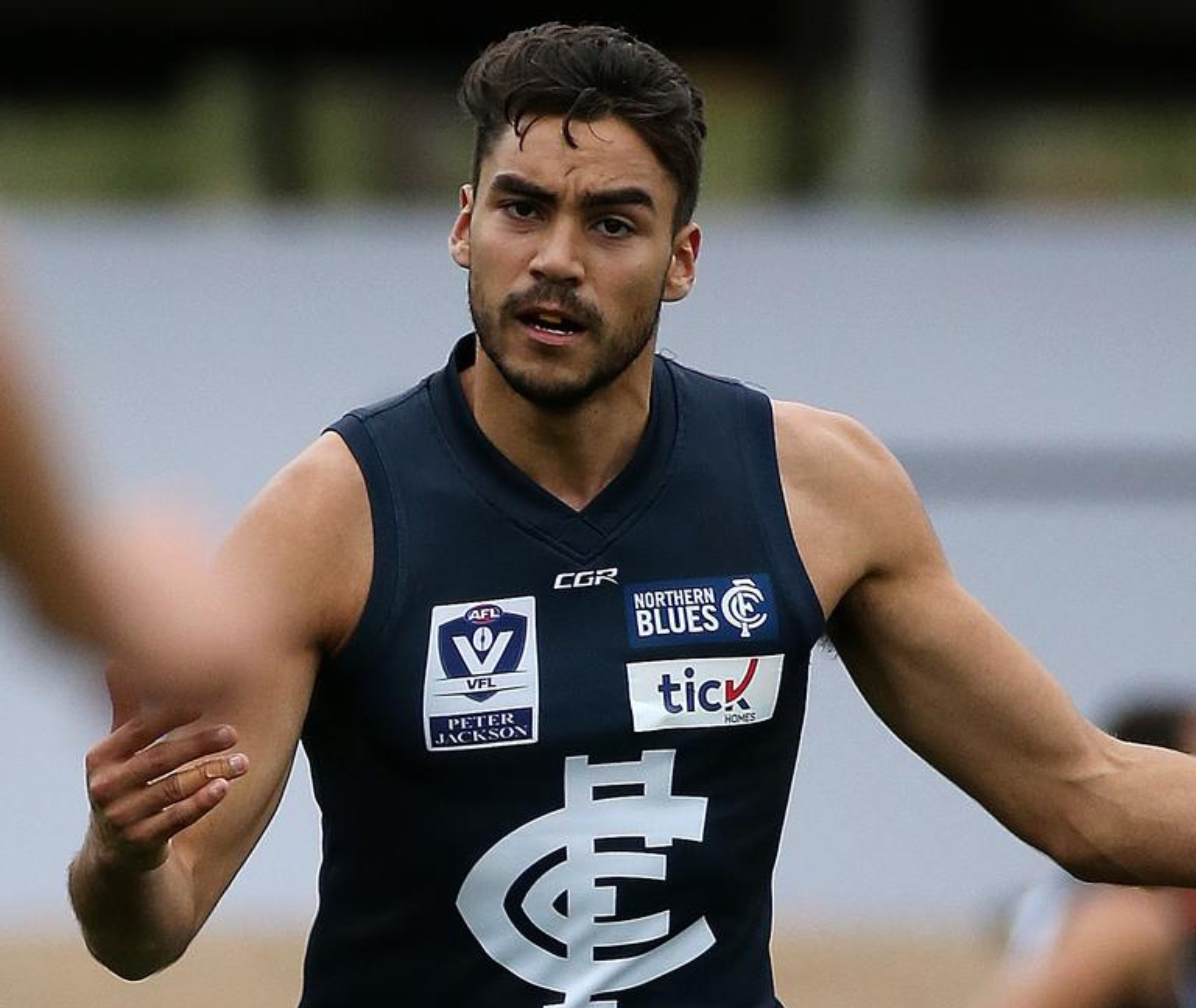 Close up image of Ethan. He is wearing a Carlton top.