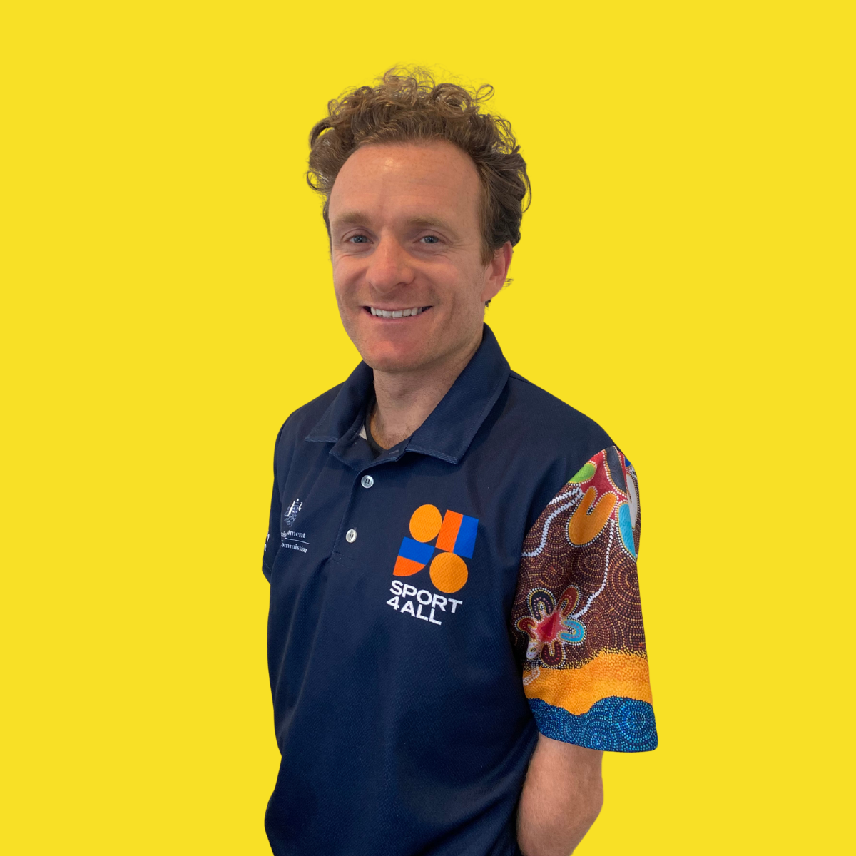 A close-up image of Sport4All's National Manager, Mitch. He is wearing the Sport4All polo.