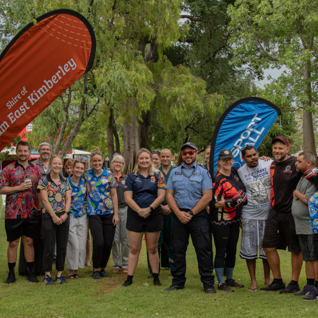 All participants of the day gathered together looking at the camera and smiling.