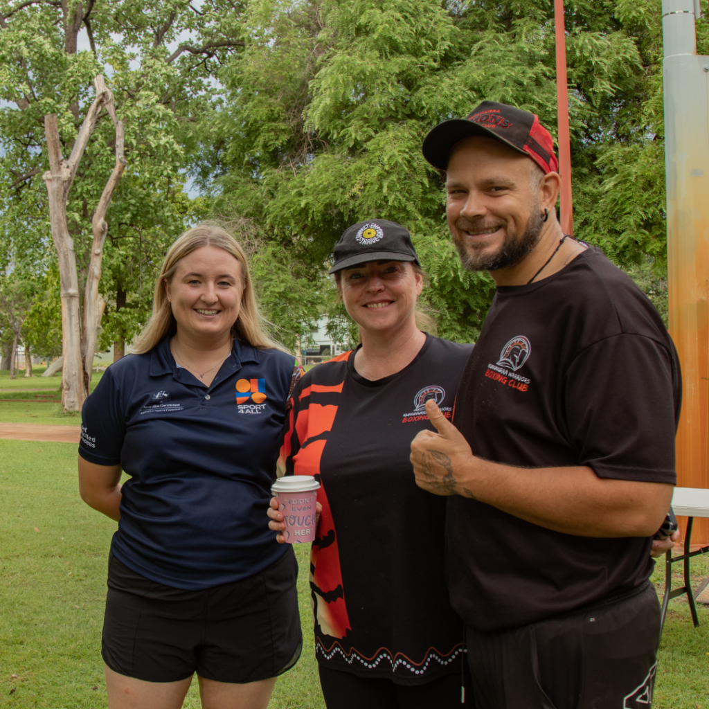 Sport4All Inclusion Coach Lucy Ballard stands with Kununurra Bowling Club members, all looking at the camera.