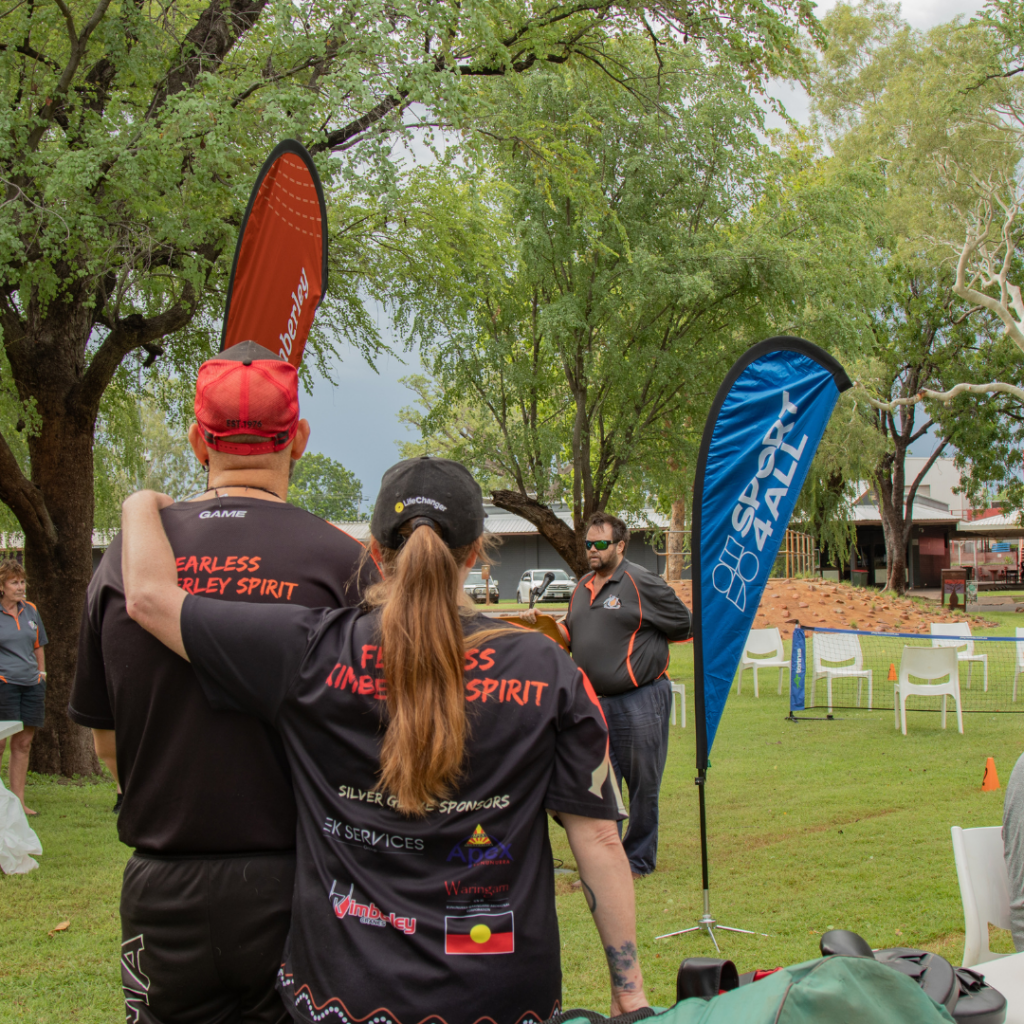 Kununurra Bowling Club members watch as SWEK team member speaks to a group of participants. A Sport4All banner is visible next to the speaker.