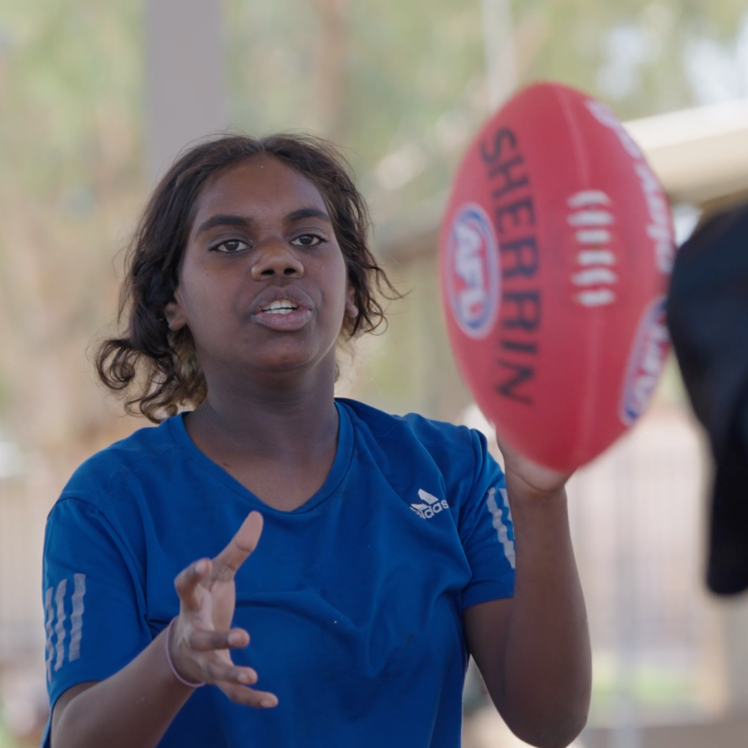 A person playing footy