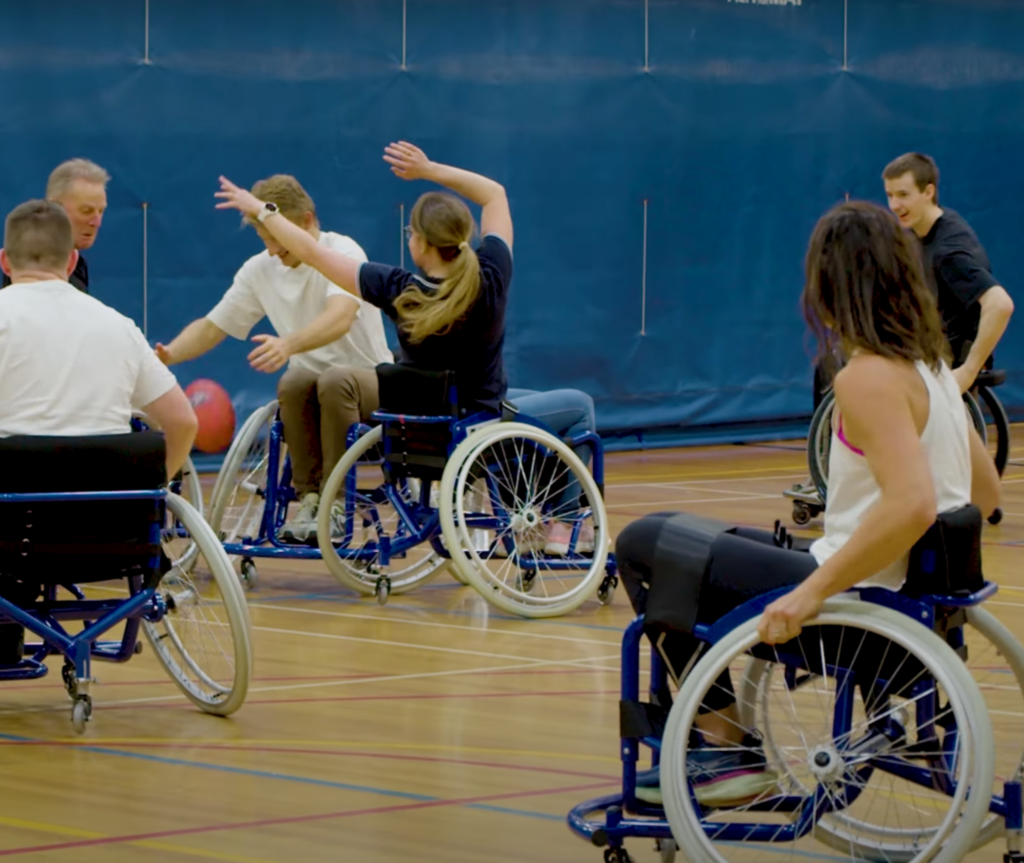 People playing wheelchair footy