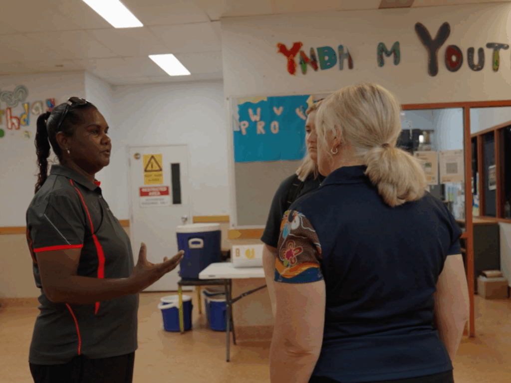 Sport4All team speaking to a local facilitator