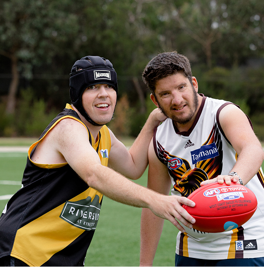 Two footy players competing.