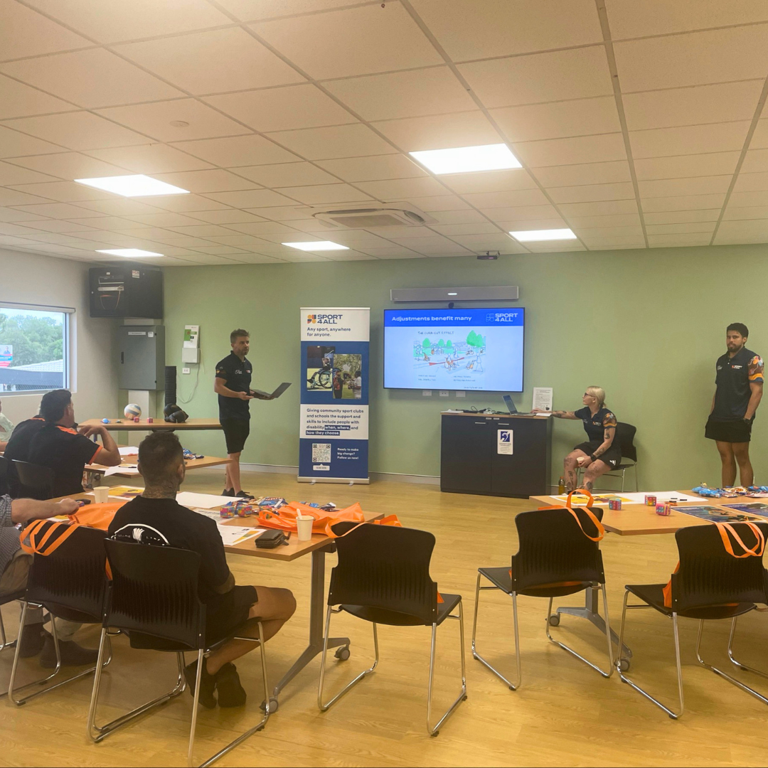 Sport4All team delivers a disability inclusion session to participants in a training room.