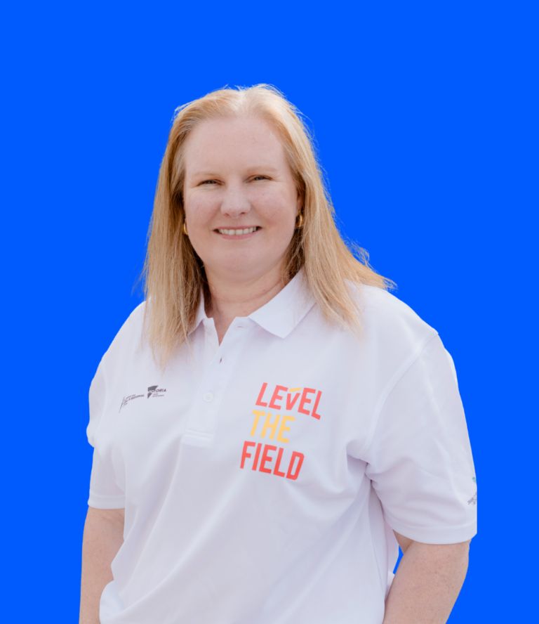 Tanya's close up image in a white Level The Field branded polo