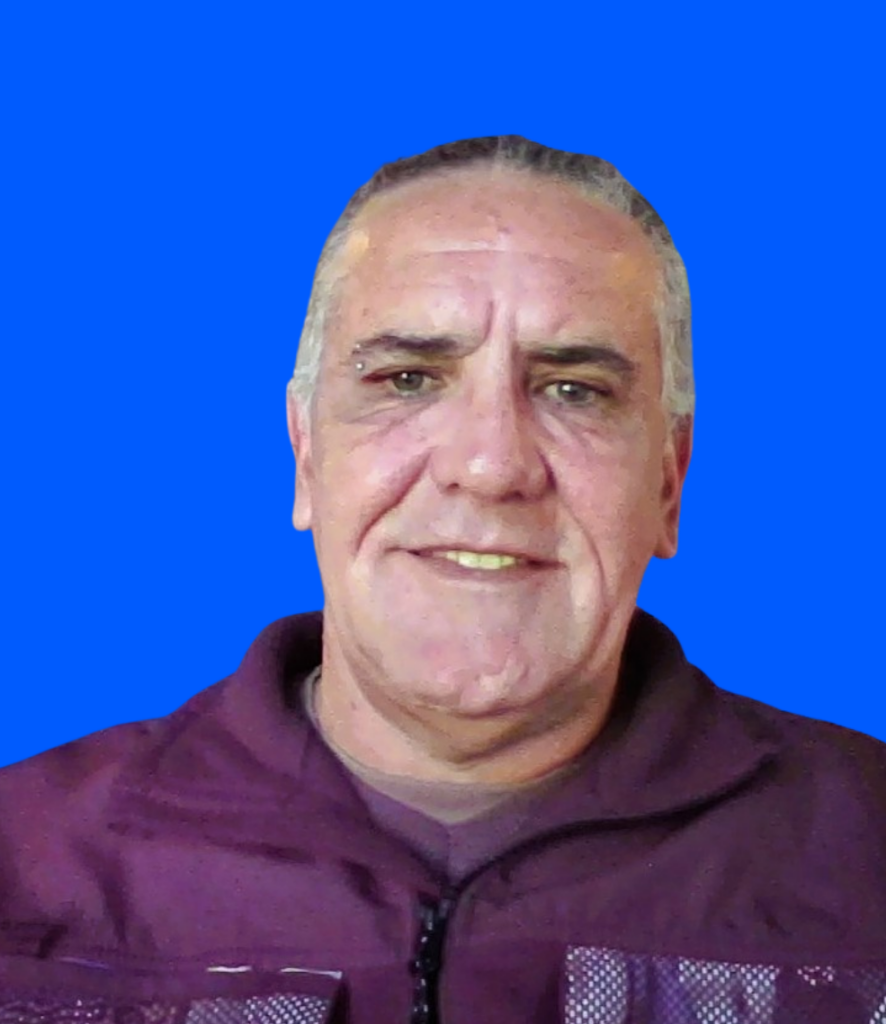 John's close up image in red shirt